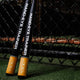 Axe™ Hand-Eye Trainer Bats leaning on the fence