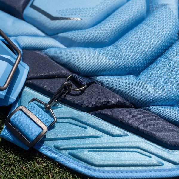 Close-up of the clip system on the chest protector in the Easton MAV X Intermediate Catchers Kit - Columbia/Navy