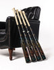 2027 Marucci CATX RCKLESS Hybrid -3 BBCOR Baseball Bats resting against a lounge chair
