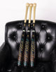 2027 Marucci CATX RCKLESS Hybrid Puck -3 BBCOR Baseball Bats resting on a lounge chair