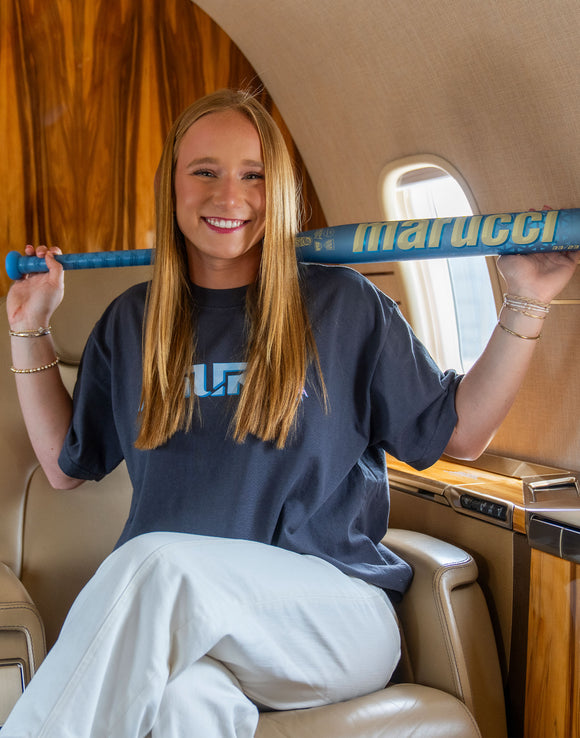 Player modeling the Marucci Asura Rise Fastpitch Bat