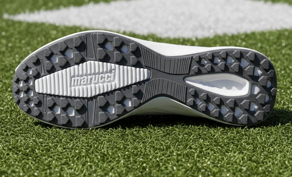 View of the sole of the View of the heels of the Marucci CFT Youth Turf Shoe - White