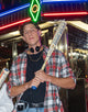 Young man holding the 2026 Marucci RCKLESS Rewind Composite USSSA Baseball Bat - Cream