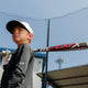 Young player carrying a Marucci CAT X -11 USA Baseball Bat