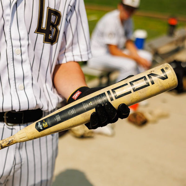 Player holding the 2025 Rawlings ICON™ -3 BBCOR Baseball Bat