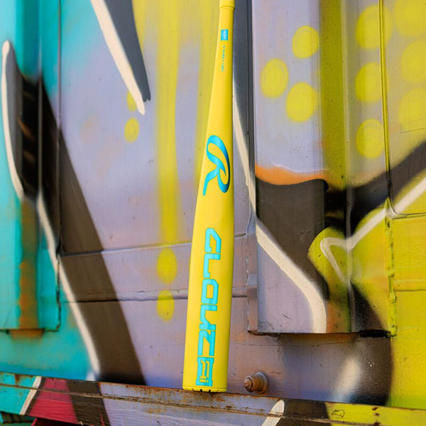 2026 Rawlings Clout Ai™ -3 BBCOR Baseball Bat resting on a cargo box