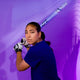 Pro player Tiare Jennings holding the 2027 Rawlings Halo Fastpitch Bat