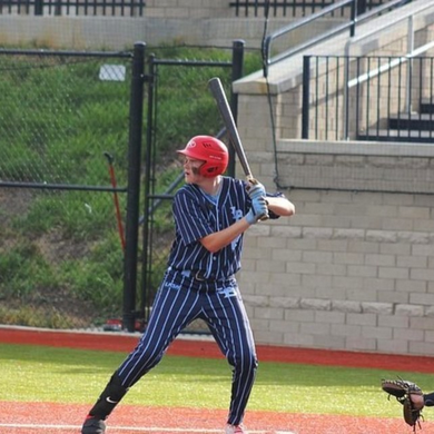 Player batting with the Warstic Workman3 Batting Glove "Light Blue"