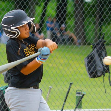 Young player batting with the Warstic Workman3 Batting Glove "Light Blue"