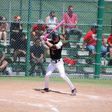 Player batting with the Warstic Workman3 Batting Glove "Battle Pink"