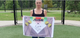 Paige Halstead displaying the fastpitch side of the All Star MVP-Pro™ Catcher Training Mat