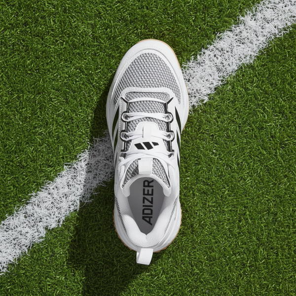 Top view of the Adidas Adizero DGT Turf Trainer Shoe