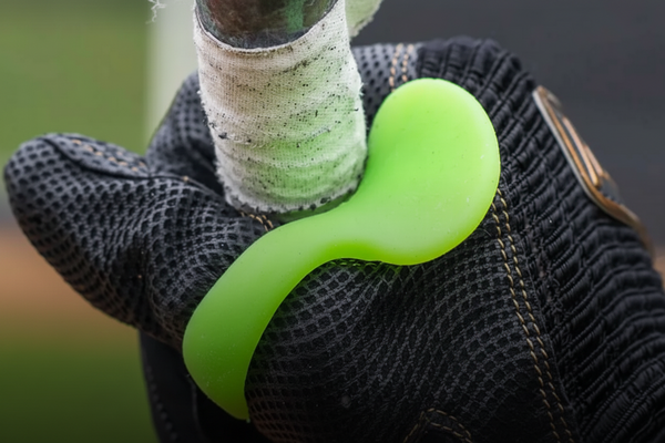 Batter wearing the ThumbPro Batter's Thumb Guard