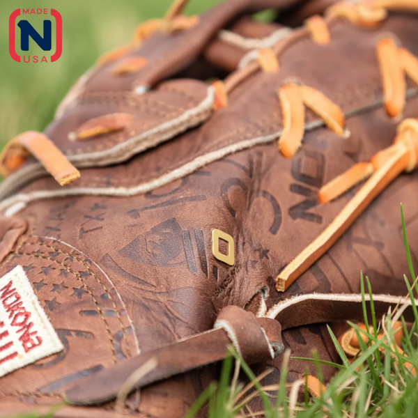 Close-up of the custom stamping on the side of the Nokona Walnut Edge™ Precision 13" Baseball First Base Mitt