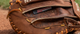Close-up of the custom stamping on the outside of the Nokona Walnut Edge™ Precision 32.5" Fastpitch Catchers Mitt