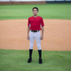 Player modeling the youth Marucci EXCEL "Tweener" Baseball Pant - White