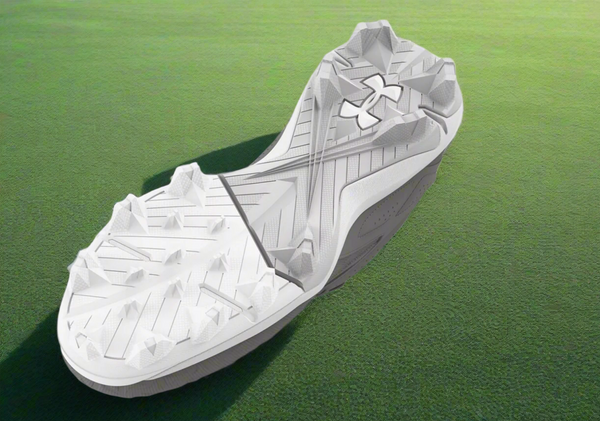 View of the sole of the Under Armour Leadoff Low RM Jr. 3.0 Youth Molded Cleat - Gray/White