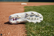 View of the sole of the Under Armour Youth Harper 10 RM Jr. Baseball Cleats - White/Stone
