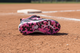 View of the sole on the New Balance Youth Romero Duo Molded Cleat - Black/Pink