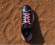 Top view of the New Balance Youth Romero Duo Molded Cleat - Black/Pink