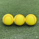 A line of three Truflight Aceballz Pitching Machine Softballs