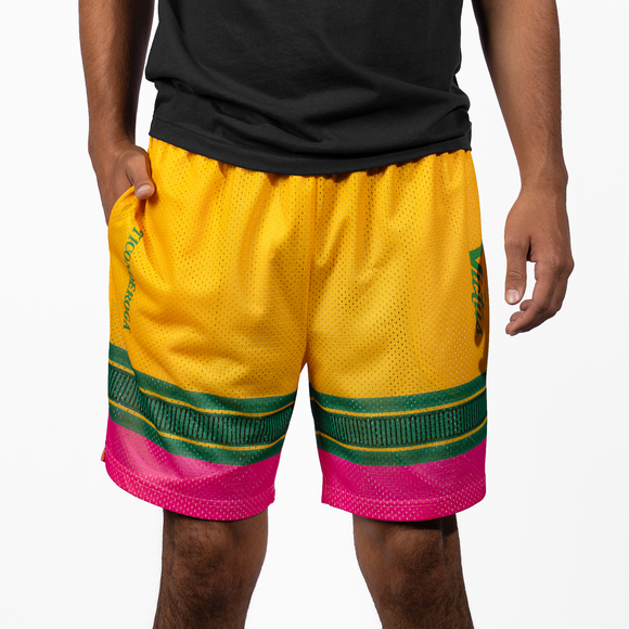 Youth modeling a pair of Victus Youth Pencil Mesh Shorts - Yellow