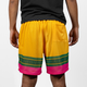 Rear view of a youth modeling a pair of Victus Youth Pencil Mesh Shorts - Yellow