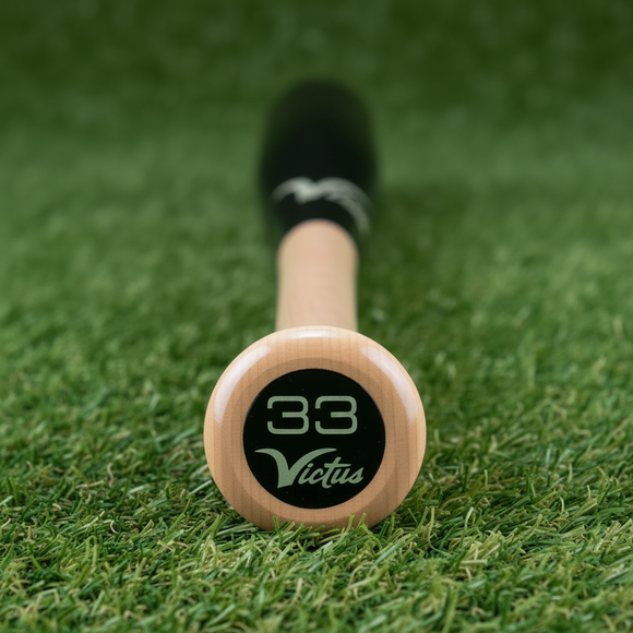 Close-up of the knob on the Victus Pro V Cut Gloss Maple Wood Baseball Bat - Natural/Gloss Black