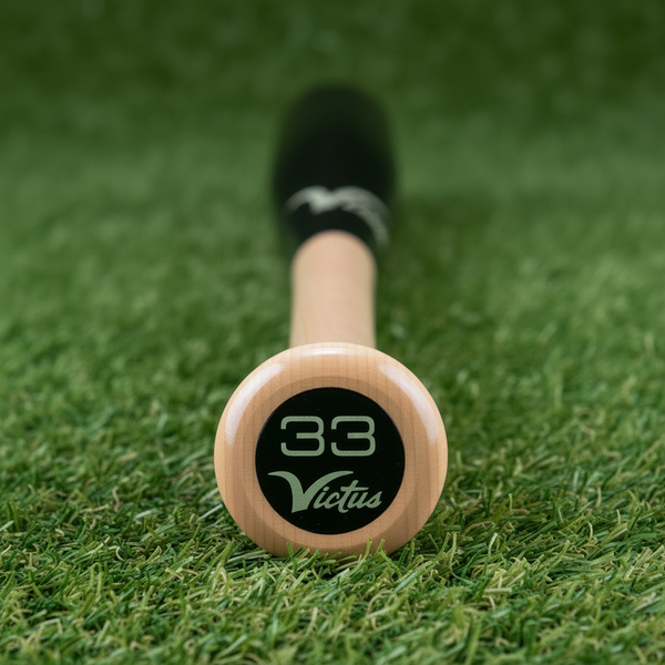 Close-up of the knob on the Victus Pro V Cut Gloss Maple Wood Baseball Bat - Natural/Gloss Black