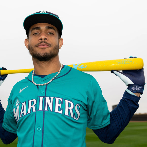MLB® star Julio Rodriguez holding the Victus Pro Reserve Julio Rodriguez JROD SHOW Maple Wood Baseball Bat