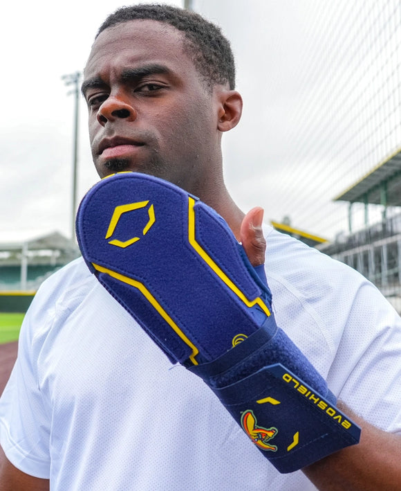 Player wearing the Evoshield X-SRZ™ Savannah Bananas Sliding Mitt 2.0