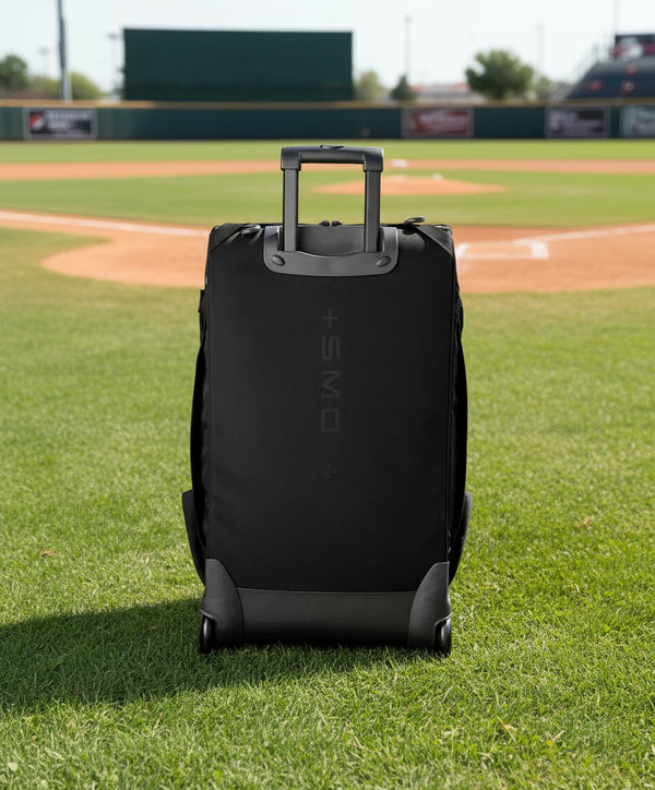 Rear view of the Evoshield Takeover Utility Wheeled Bag - Black in an upright position
