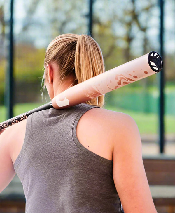 Player holding a 2025 DeMarini Whisper -10 Fastpitch Bat