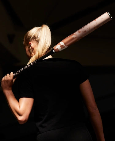 Player holding the 2025 DeMarini Whisper -9 Fastpitch Bat