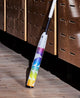 2025 DeMarini Prism Plus+  -11 Fastpitch Bat leaning against a wall