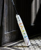 2025 DeMarini Prism Plus+  -10 Fastpitch Bat leaning against the wall