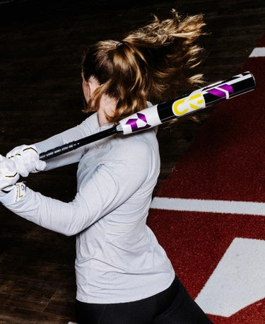 Player swinging the 2025 Demarini CF® -11 Fastpitch Bat