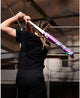 Player swinging the 2025 DeMarini Spryte -12 Fastpitch Bat