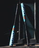 2026 DeMarini Omega -3 BBCOR Baseball Bats leaning against a wall