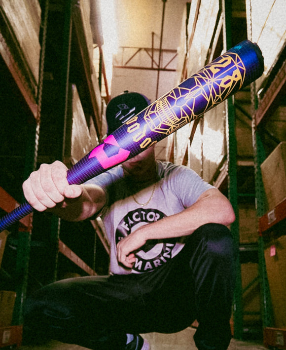 Man holding the 2026 DeMarini Voodoo® One -3 BBCOR Baseball Bat