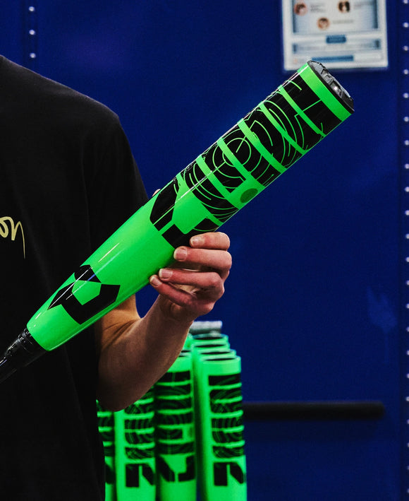 Person holding a 2026 DeMarini Zen USSSA Baseball Bat with a close-up of the barrel