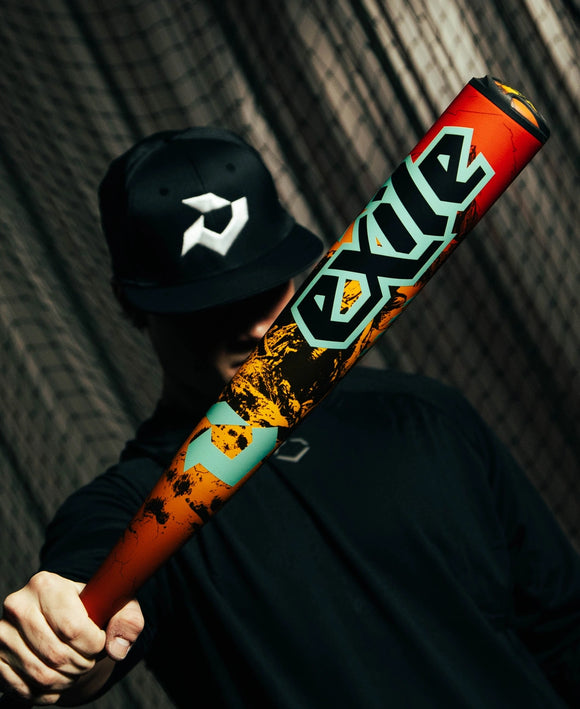 Player in the shadows holding the 2026 DeMarini Exile™ Rogue -3 BBCOR Baseball Bat