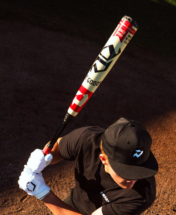 Player swinging the 2027 DeMarini The Goods™ -3 BBCOR Baseball Bat