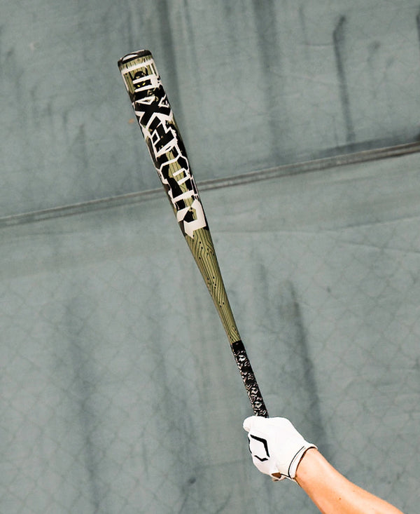 Player holding up the 2027 DeMarini Exile™ -3 BBCOR Baseball Bat