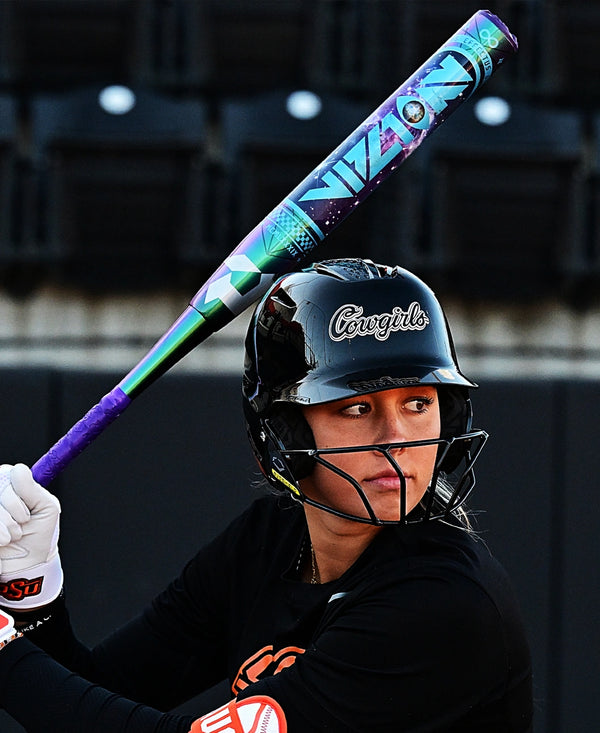 Player batting with the 2027 DeMarini Vizion Fastpitch Bat