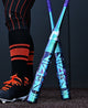 Close-up of a player standing near two 2027 DeMarini Vizion Fastpitch Bats