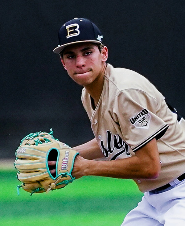 Young infielder making a play with the Wilson 2027 A2000® 1975 11.75" Baseball Glove