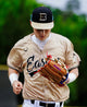 Young player running with the Wilson 2027 A2000® 1777 12.75" Baseball Glove