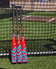 Trio of 2024 Louisville Slugger Select PWR™ -10 USA Baseball Bats near a batting cage