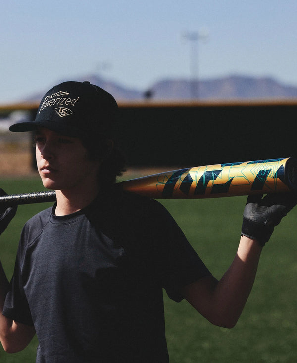 Player holding 2024 Louisville Slugger META® -5 USSSA Baseball Bat